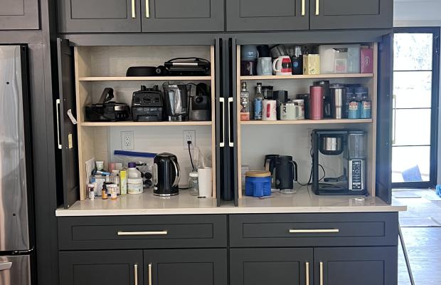 Charcoal shaker coffee station with its pocket doors open above the counter