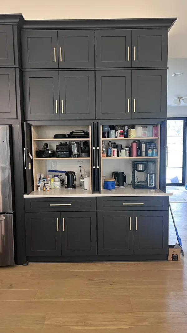 Charcoal shaker coffee station with its pocket doors open